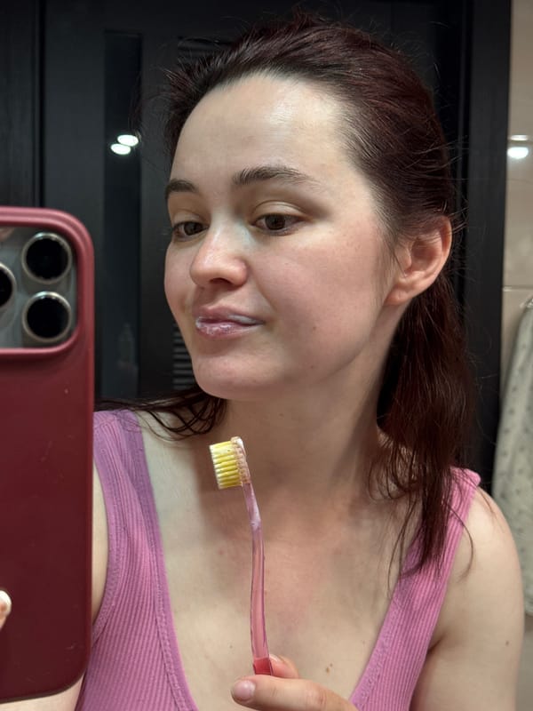 Woman documents late-night dental routine in Sochi bathroom selfies