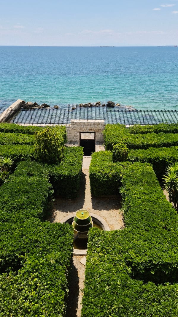 Taranto's Aragonese Castle and waterfront on a July morning