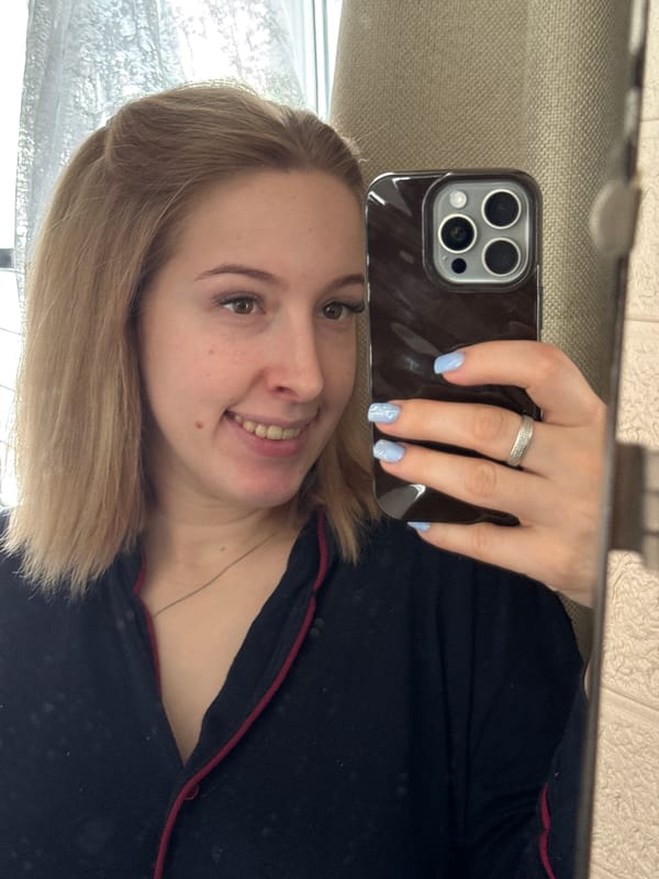 Woman takes mirror selfies with toddler in Donetsk home