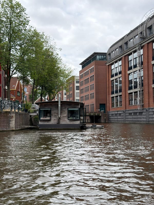Floating through Amsterdam's canals on a grey summer afternoon
