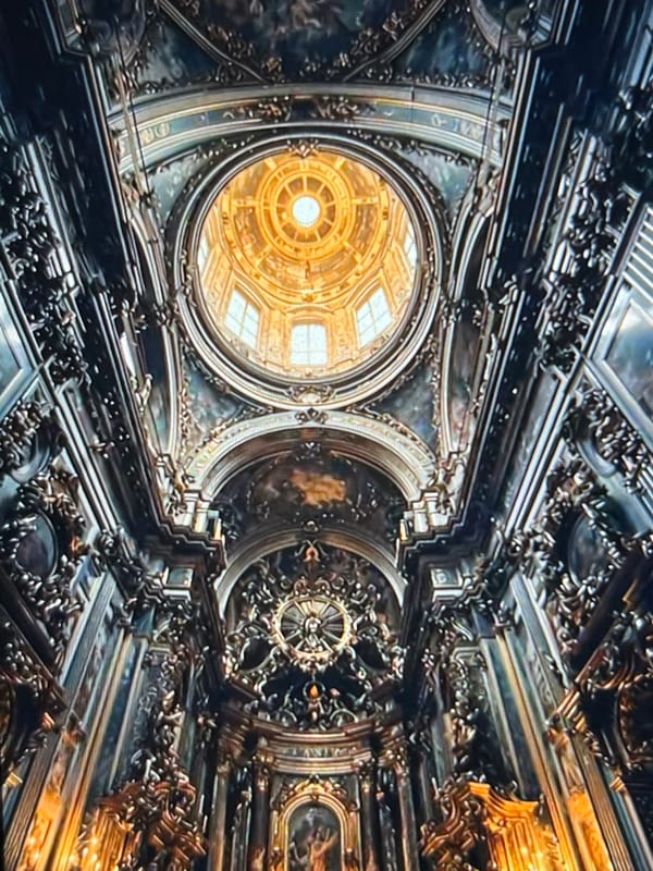 Religious artwork and ornate ceiling documented in Tinaquillo church