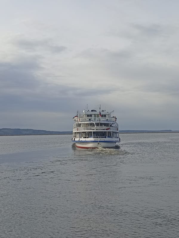 Russian cruise ships observed at waterfront port with passengers