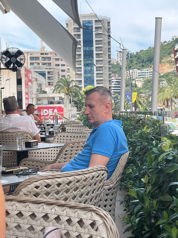 Summer morning at an outdoor café in Budva, Montenegro.