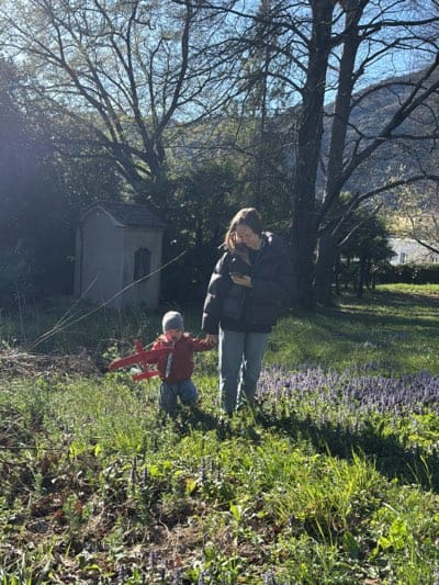 Woman and child walk together in Erba, Italy