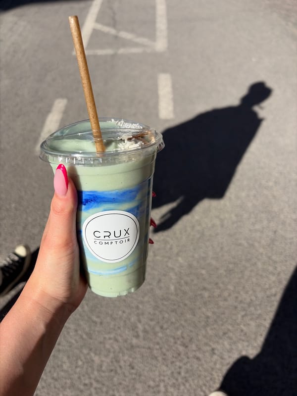 Montreal resident enjoys colorful beverage from Crux Comptoir