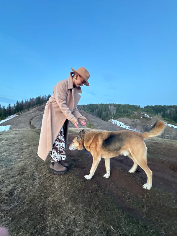 Woman with dog spotted on rural slope near Ольховка