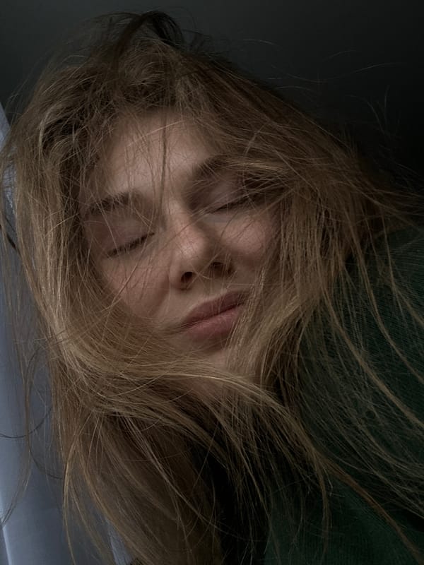 Person resting indoors captured in Kazan residential area