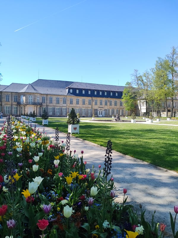 Spring day visitors enjoy Hofgarten palace gardens in Bayreuth