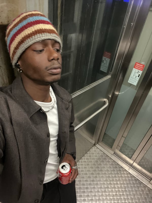 Man in striped beanie spotted across Barcelona transit locations