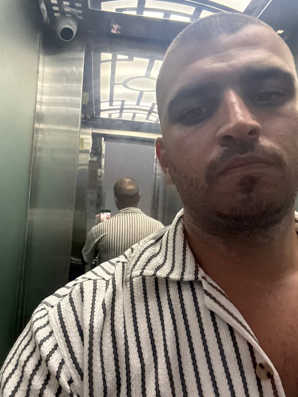 Person takes elevator selfie in Đà Nẵng building