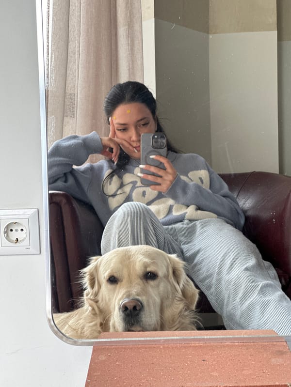 Woman, golden retriever share quiet morning in Yerevan, Armenia