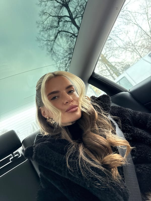 Woman filmed making faces in car backseat in Berlin