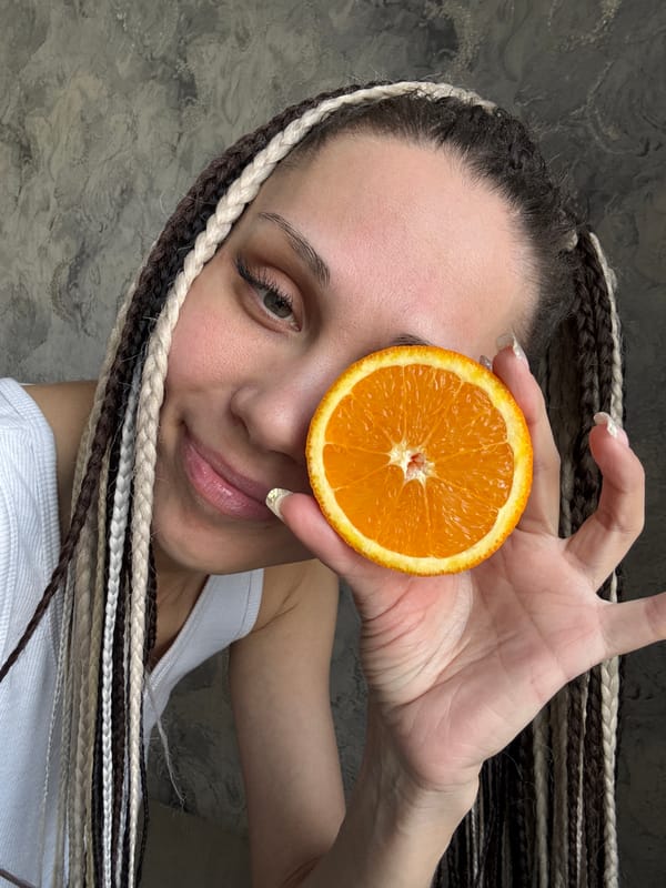 Portrait session captured in Rusanovo features playful orange poses