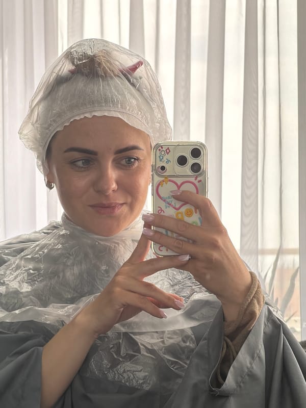 Woman takes salon selfies during hair treatment in Votkinsk