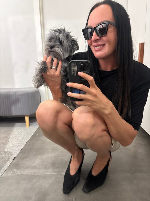 Woman takes selfies with gray dog in Chaikovsky