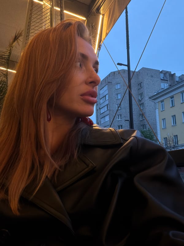 Auburn-haired woman spotted multiple times in rainy Krasnoyarsk evening