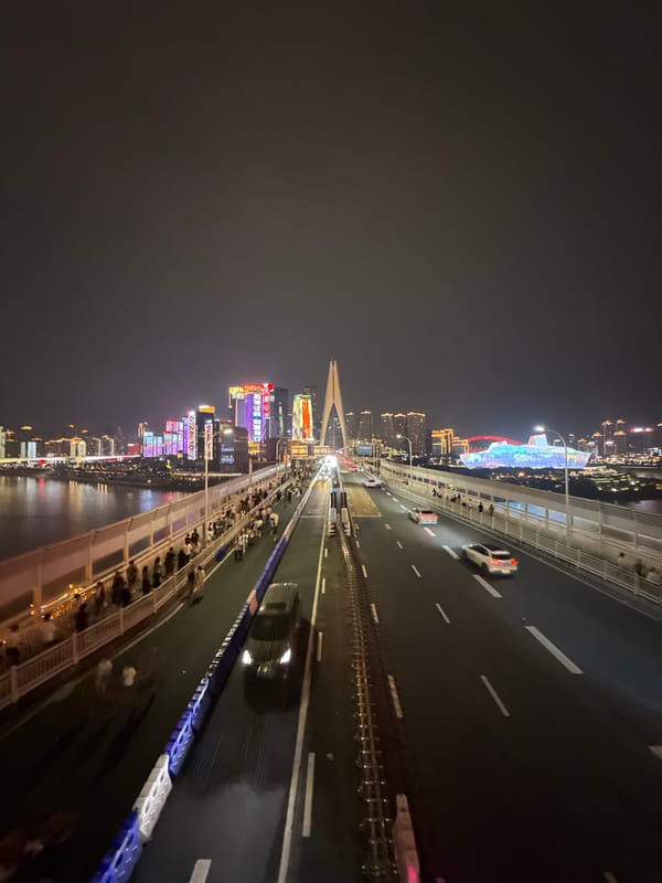Night crowd soaks in Chongqing's Yuzhong bridge and skyline