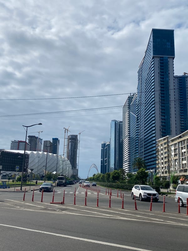 Batumi's modern streetscape mid-construction on a overcast afternoon