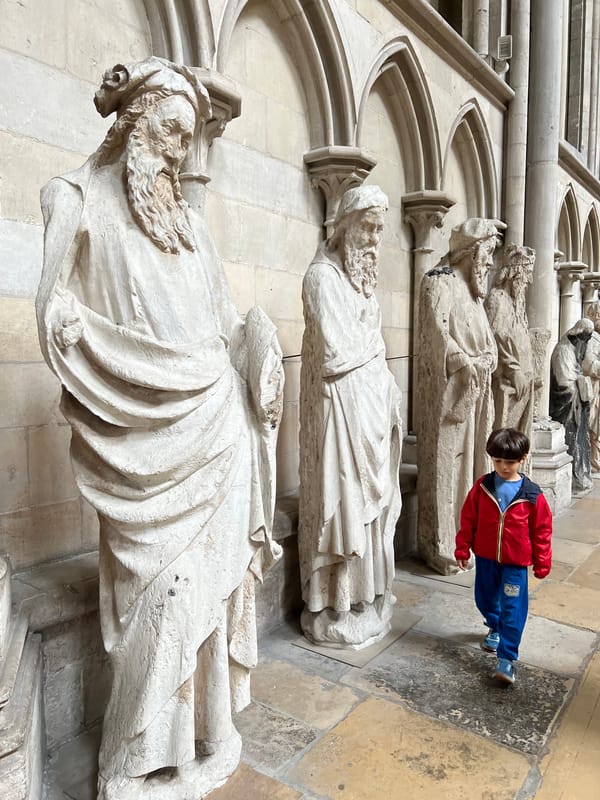 Boy in colorful jacket spotted inside historic stone cathedral