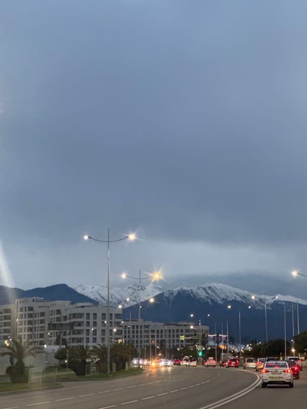Urban scenes captured in Sirius, Russia amid mountain backdrop