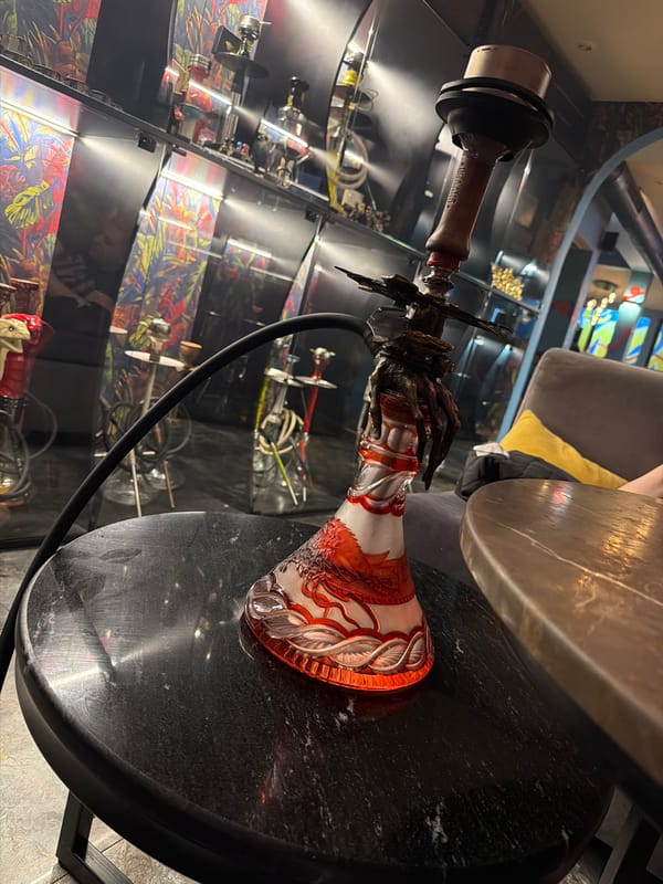 Ornate hookah spotted on marble table in Sofia establishment