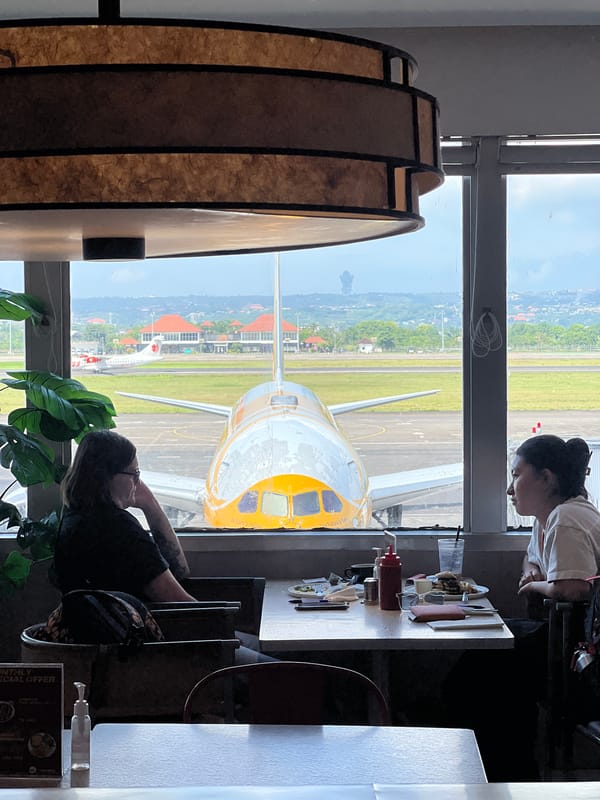 Traveler documents early morning airport experience in Kuta, Indonesia