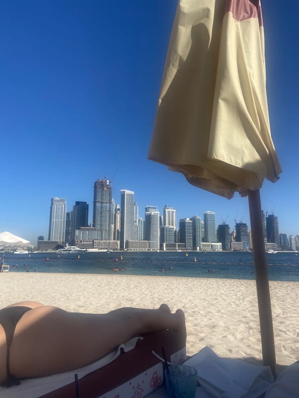 Clear day at Dubai beach with skyline view