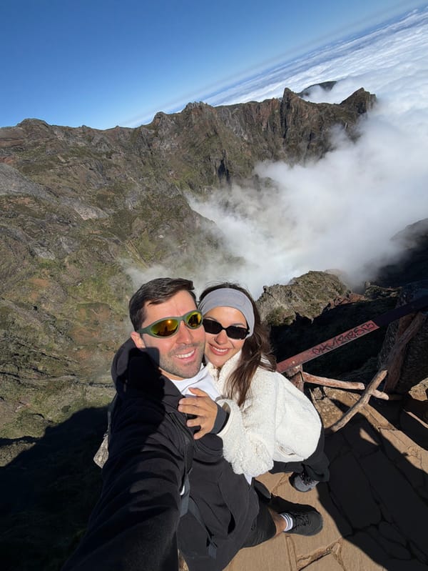 Tourists explore Madeira's mountain peaks above cloud layer