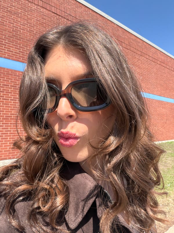 Woman in sunglasses photographed in Longueuil, Canada