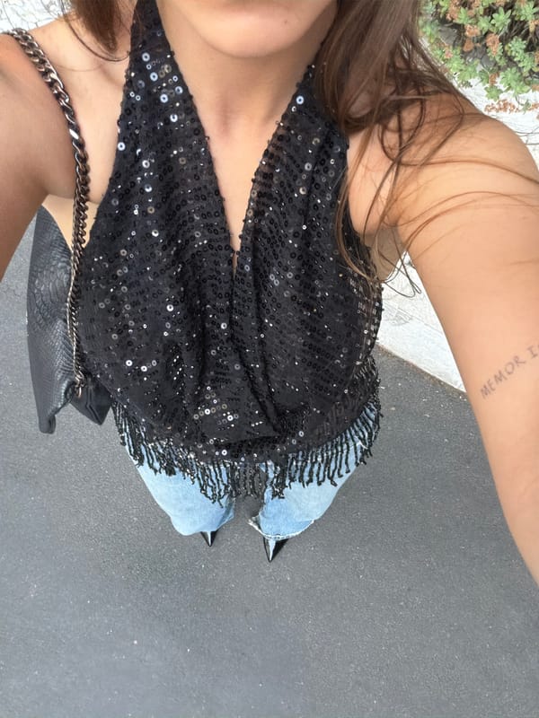 Person photographed in sequined outfit in Milan