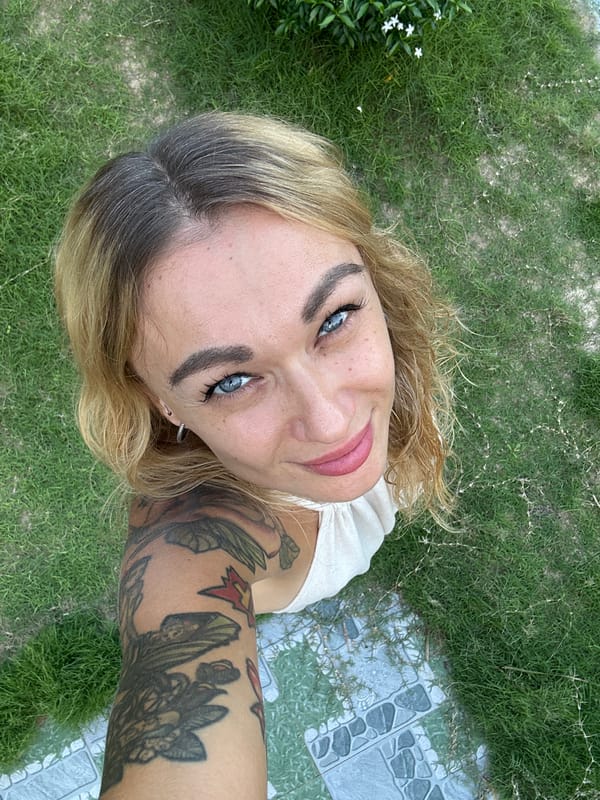 Woman takes multiple selfies in Mũi Né, Vietnam