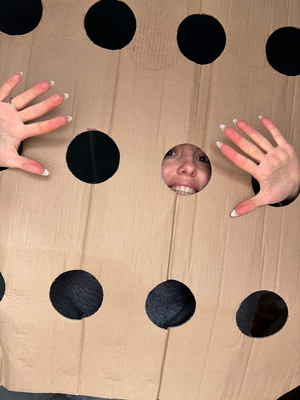 Woman plays with cardboard cutout in Izhevsk