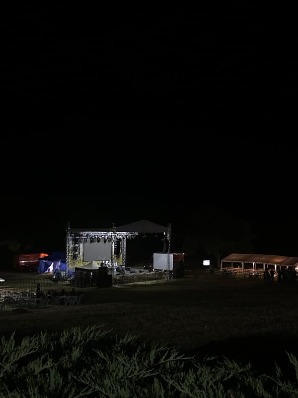 Outdoor stage and lighting rig set up for night event in Shumen