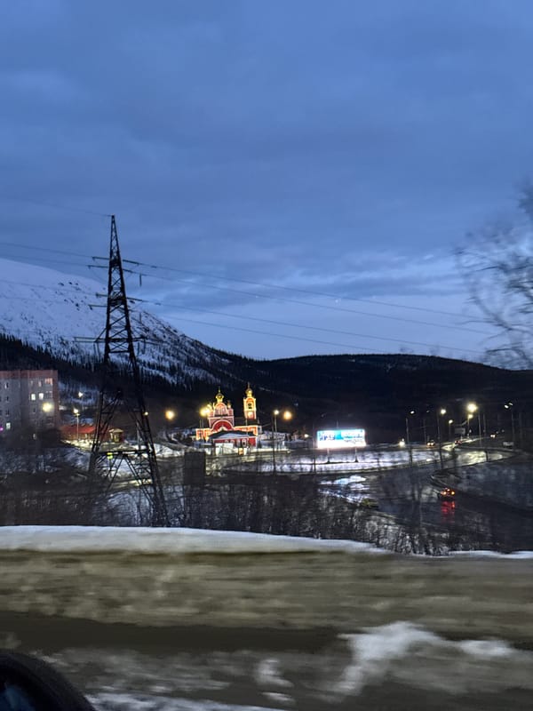 Evening transmission tower view captured in snowy Kirovsk