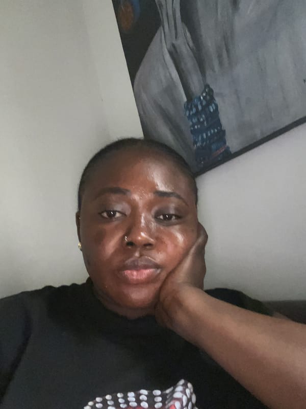 Woman documents selfie session during rainy afternoon in Abuja