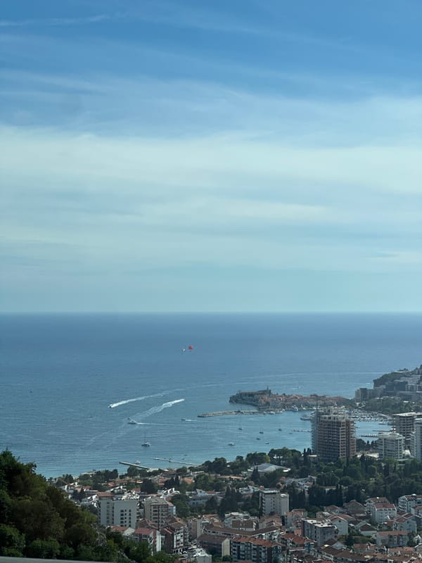 Coastal road trip through Vrela with paragliders above the Adriatic