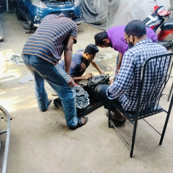 Mechanics repair car engine at Dhaka auto shop
