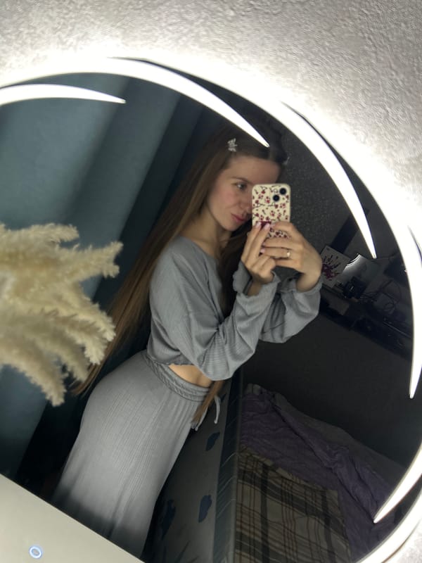 Woman takes mirror selfies in Klin apartment