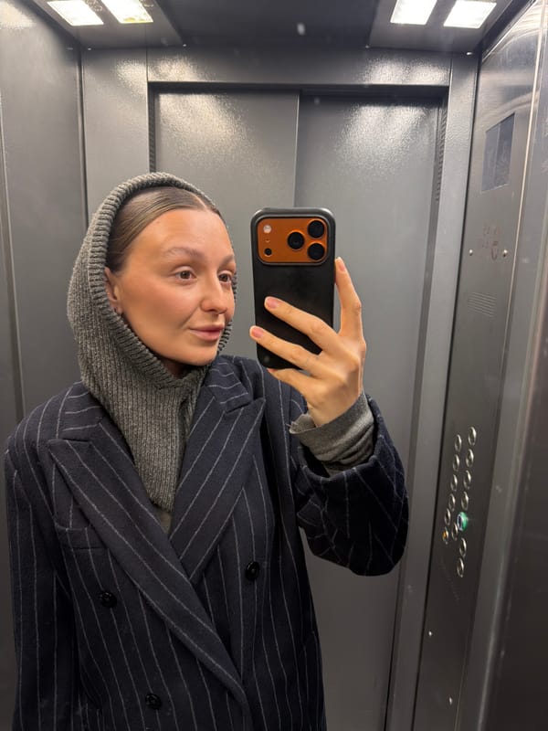 Moscow morning: elevator selfie and man with white roses