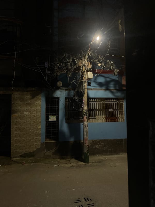 Nighttime street scenes documented in Dhaka alleyways