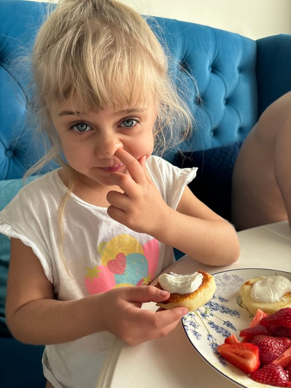 Family shares pancake meal, playtime in urban residence
