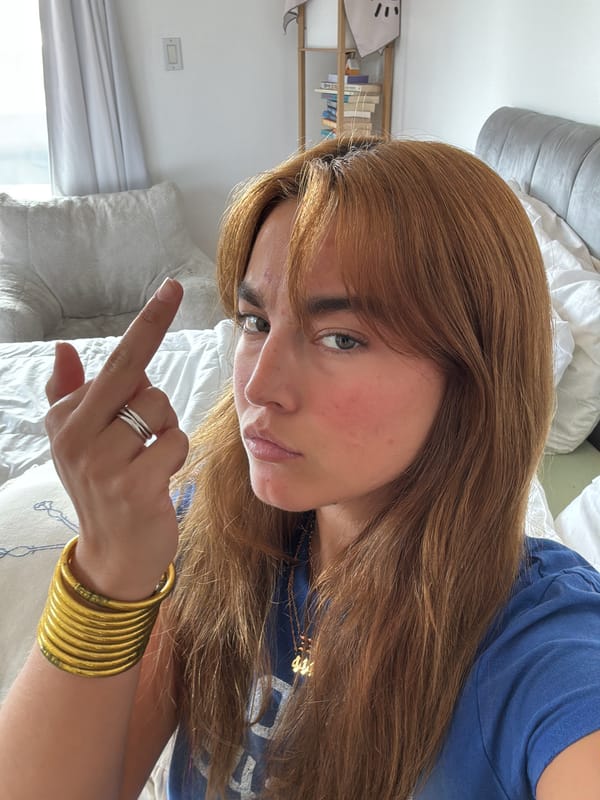 Woman makes defiant gesture in Los Angeles photo