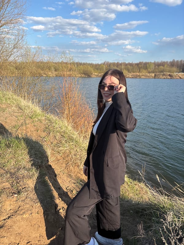 Woman poses for photos by lake in Zaosinovo Russia