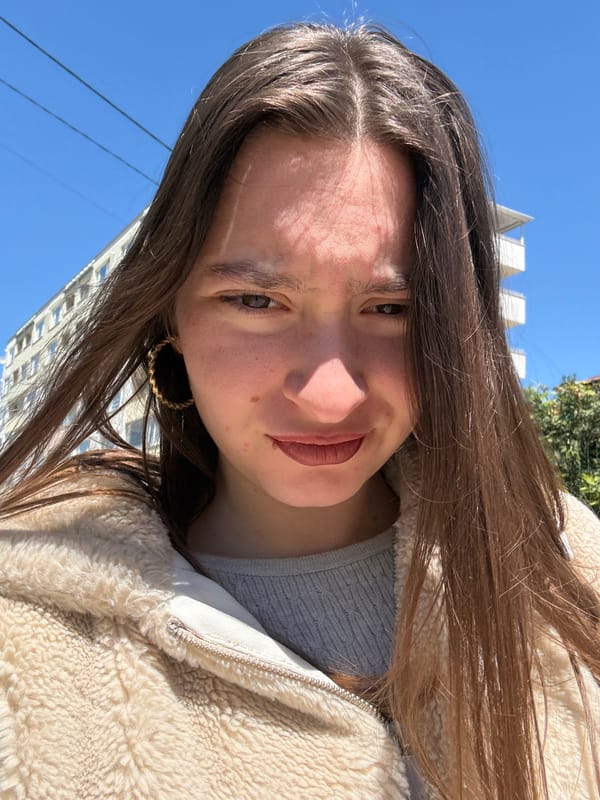 Woman takes selfies on sunny Sofia street