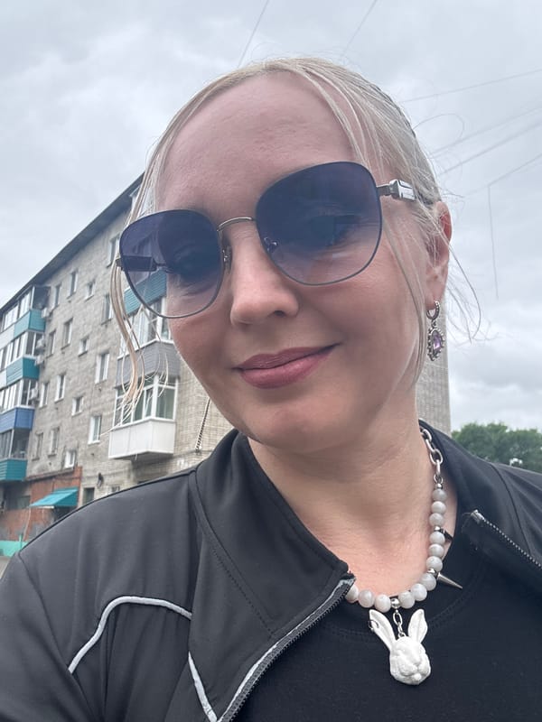 Selfie moment outside a brick apartment block in Komsomolsk-on-Amur