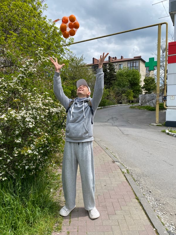 Person handles bag of oranges in Gelendzhik, Russia