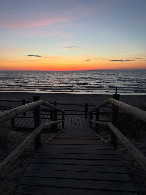 Sunset observed at Garciems beach, Latvia with wooden stairs