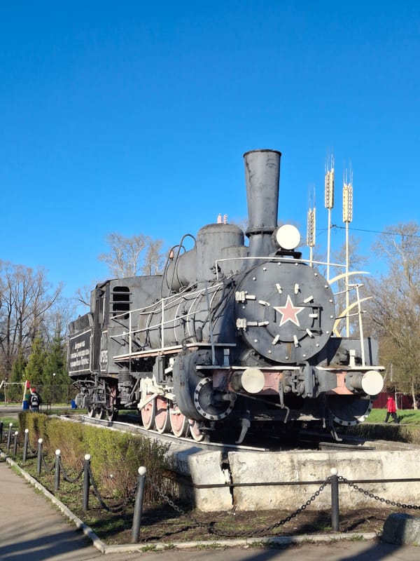 Woman visits historic locomotive monument in Sarapul, Russia