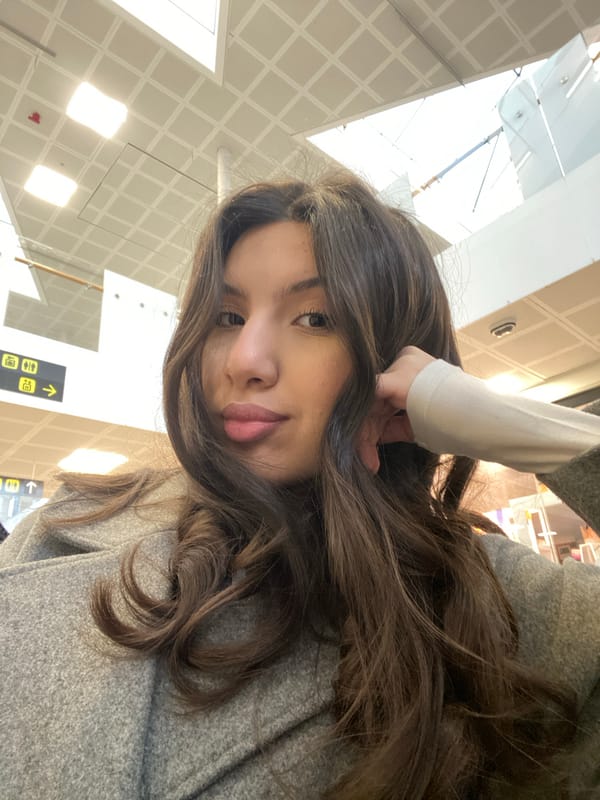 Woman takes early morning selfies at Uppsala Central Station