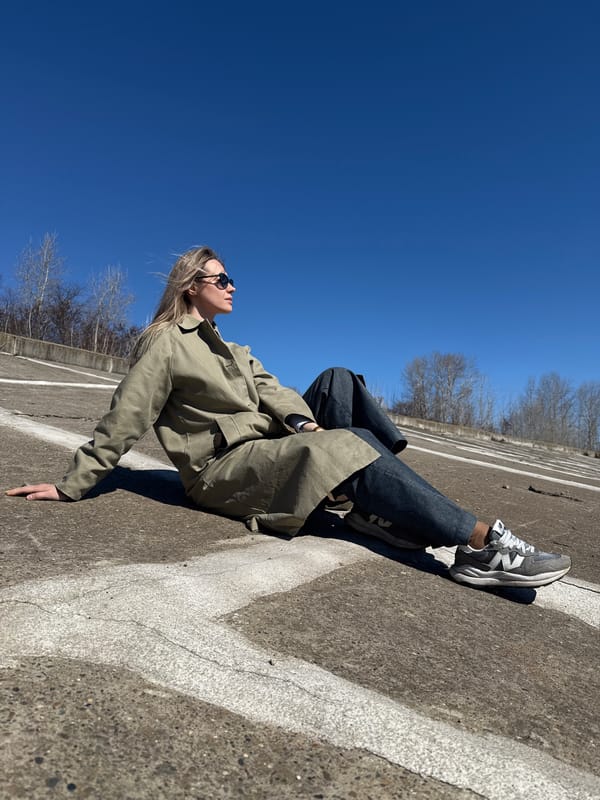 Woman rests on concrete surface in Chaikovsky, Russia